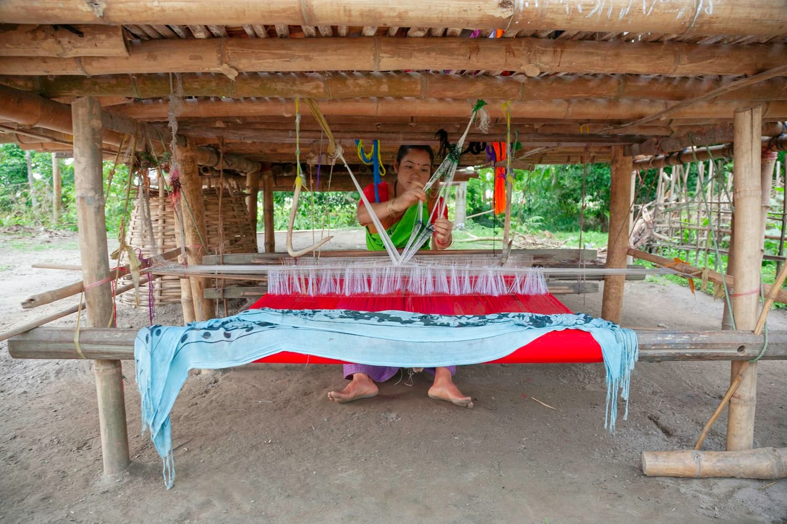 Karigar at the loom in the ParasLace workshop